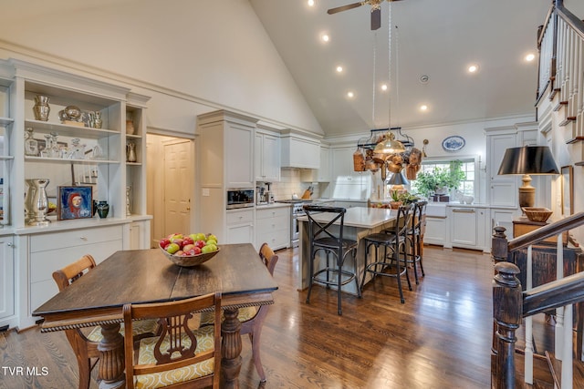 1221 Radcliffe Ave, Kingsport, TN 37664 - dining space with dark wood-style floors, high vaulted ceiling, stairs, and a ceiling fan