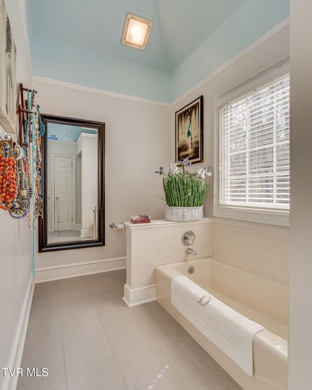 1221 Radcliffe Ave, Kingsport, TN 37664 - full bath featuring lofted ceiling, baseboards, tile patterned floors, a garden tub, and visible vents