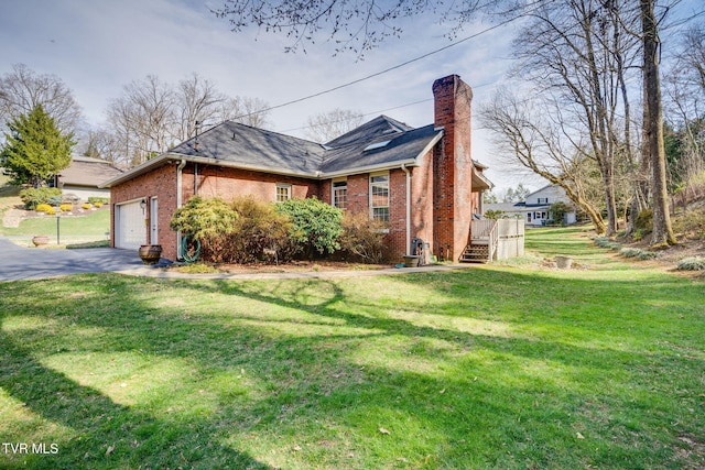 1221 Radcliffe Ave, Kingsport, TN 37664 - view of side of home featuring an attached garage, brick siding, aphalt driveway, and a lawn