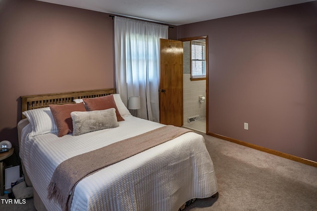 118 Starlite Dr, Greeneville, TN 37743 - carpeted bedroom featuring connected bathroom, baseboards, and visible vents