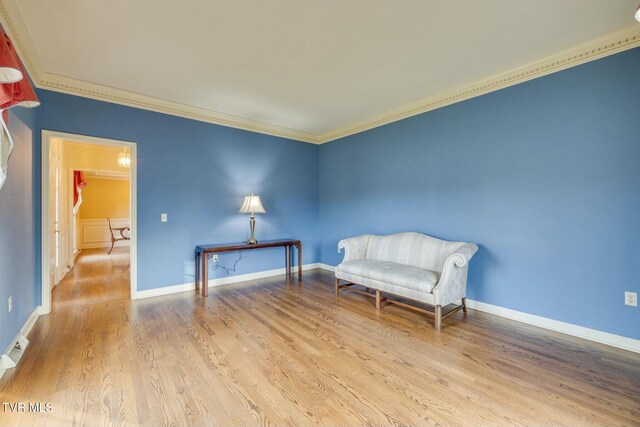 2017 Springfield Ave, Kingsport, TN 37664 - sitting room featuring baseboards, wood finished floors, and crown molding