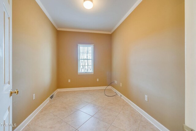 2017 Springfield Ave, Kingsport, TN 37664 - tiled empty room with baseboards, visible vents, and ornamental molding