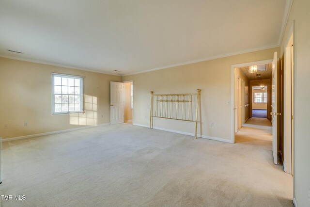 2017 Springfield Ave, Kingsport, TN 37664 - unfurnished bedroom featuring light carpet, baseboards, visible vents, and ornamental molding