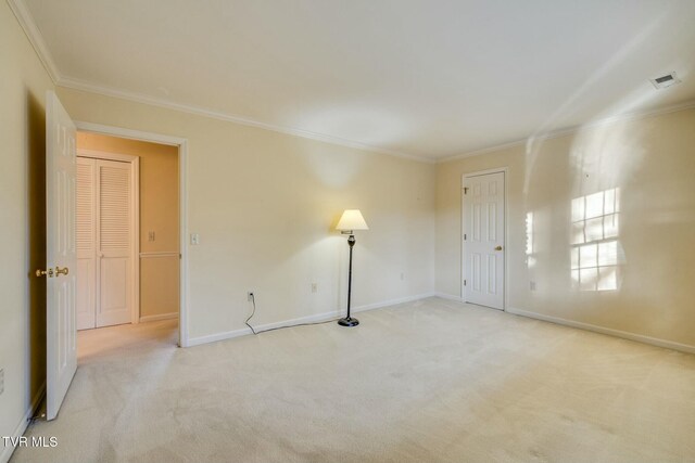 2017 Springfield Ave, Kingsport, TN 37664 - carpeted empty room with baseboards, visible vents, and crown molding