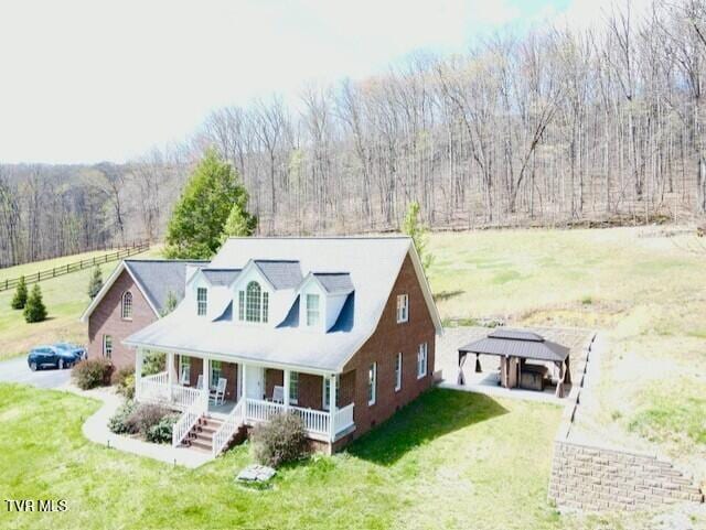 164 Kermit Day Rd, Big Stone Gap, VA 24219 - exterior space with a forest view, a gazebo, a front lawn, a carport, and a porch