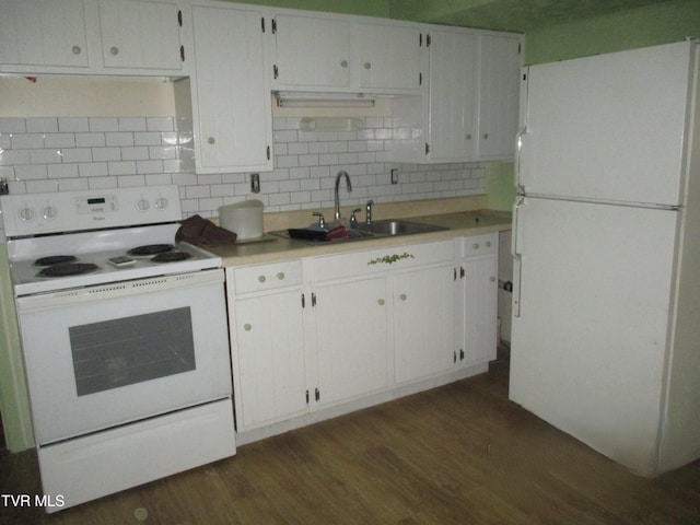 145 Rock City Rd, Kingsport, TN 37664 - kitchen featuring light countertops, tasteful backsplash, white appliances, dark wood-style flooring, and a sink