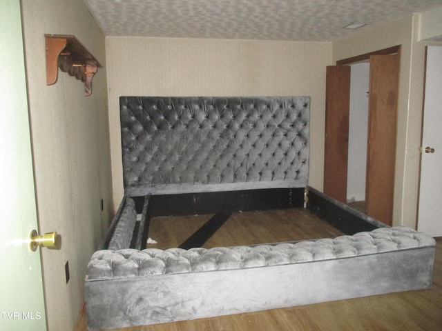 145 Rock City Rd, Kingsport, TN 37664 - interior space with wallpapered walls, a textured ceiling, and wood finished floors