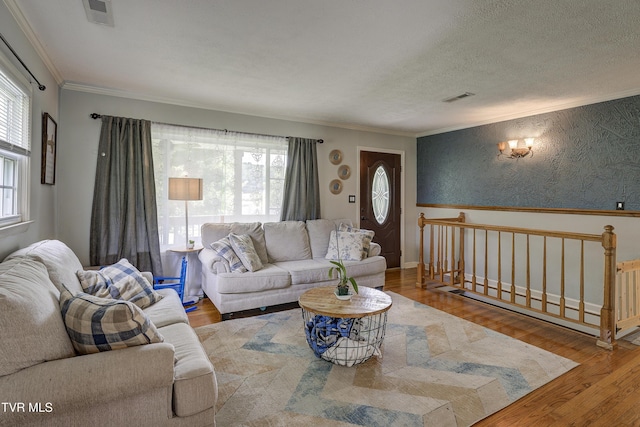 232 Meadow Dr, Bristol, TN 37620 - living area with ornamental molding, wood finished floors, a textured ceiling, and wallpapered walls