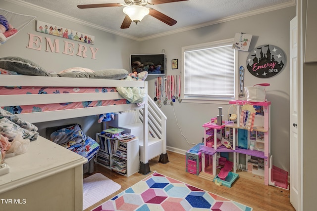 232 Meadow Dr, Bristol, TN 37620 - bedroom with wood finished floors, crown molding, a ceiling fan, and a textured ceiling