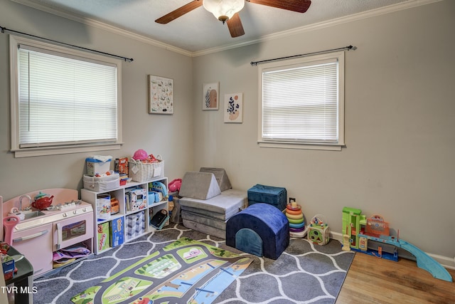 232 Meadow Dr, Bristol, TN 37620 - playroom featuring wood finished floors, ceiling fan, and crown molding