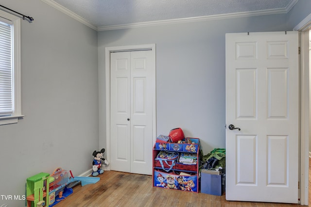 232 Meadow Dr, Bristol, TN 37620 - rec room featuring wood finished floors, crown molding, and plenty of natural light