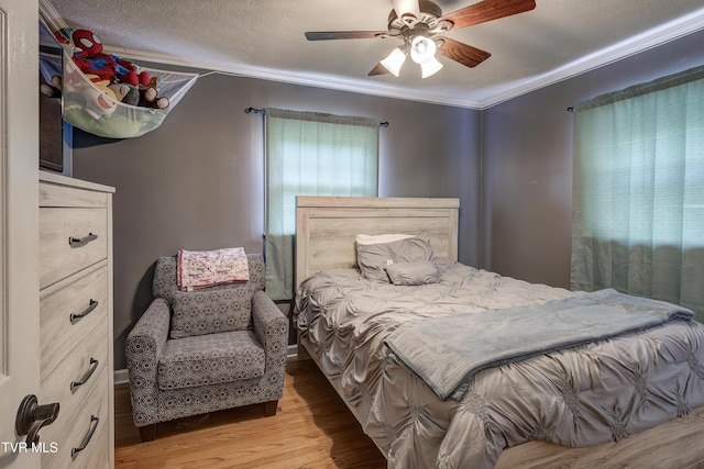 232 Meadow Dr, Bristol, TN 37620 - bedroom with light wood finished floors, ornamental molding, and ceiling fan