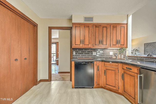 55 Grove Hill Rd, Kingsport, TN 37660 - kitchen with refrigerator, dark countertops, brown cabinetry, and dishwasher