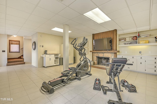 55 Grove Hill Rd, Kingsport, TN 37660 - exercise room featuring light tile patterned flooring, a fireplace, and a paneled ceiling