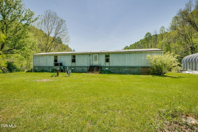 120 Bear Hollow Rd, Bristol, TN 37620 - back of house featuring a yard, entry steps, and a detached carport