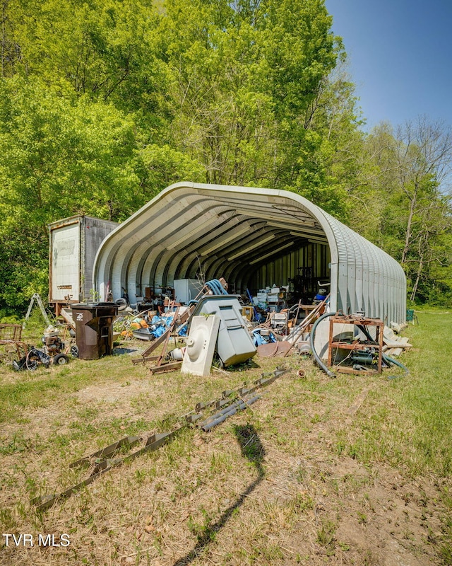 120 Bear Hollow Rd, Bristol, TN 37620 - view of vehicle parking with a view of trees and a detached carport