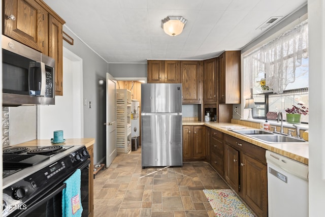 4245 Maplewood St, Kingsport, TN 37660 - kitchen featuring light countertops, a sink, stainless steel appliances, and stone finish flooring