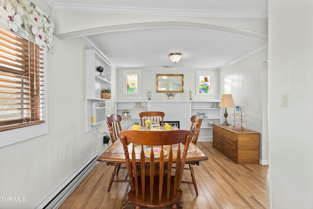 4245 Maplewood St, Kingsport, TN 37660 - dining space with a fireplace, crown molding, baseboard heating, and wood-type flooring