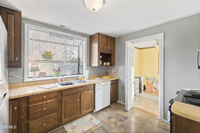 4245 Maplewood St, Kingsport, TN 37660 - kitchen with light countertops, a sink, visible vents, white dishwasher, and stone finish flooring