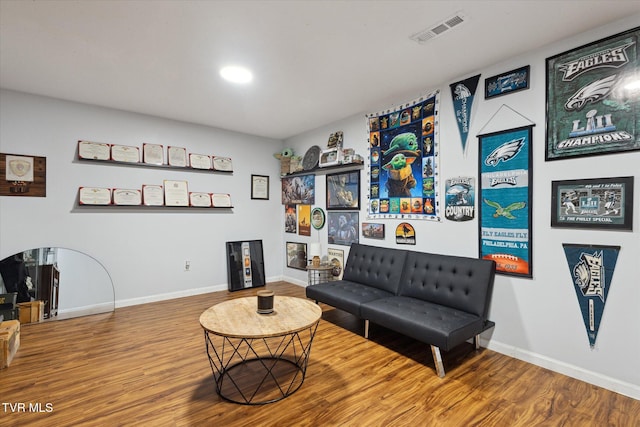 interior space featuring wood finished floors, recessed lighting, baseboards, and visible vents