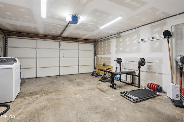 garage featuring a garage door opener and washer / clothes dryer