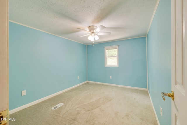 unfurnished room with visible vents, baseboards, a textured ceiling, a ceiling fan, and carpet