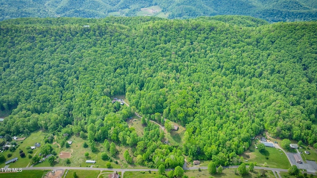 birds eye view of property with a wooded view