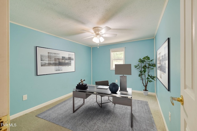 home office featuring baseboards, carpet flooring, a textured ceiling, and ceiling fan