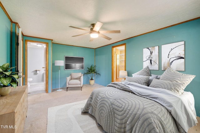 carpeted bedroom with a ceiling fan, a textured ceiling, ornamental molding, and ensuite bath