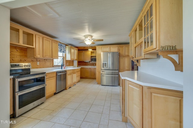 kitchen with light countertops, open shelves, stainless steel appliances, light brown cabinetry, and light tile patterned flooring