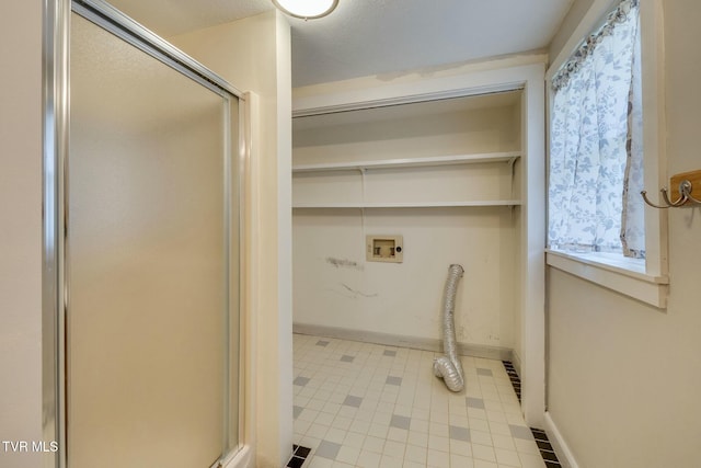 laundry room with washer hookup, baseboards, and laundry area