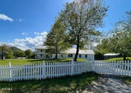 view of gate featuring a fenced front yard