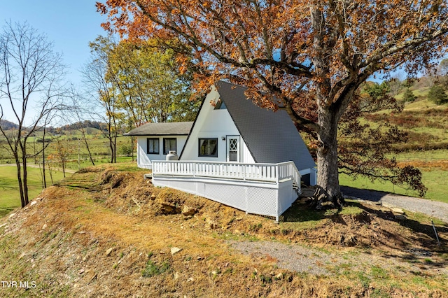 view of side of property with a deck