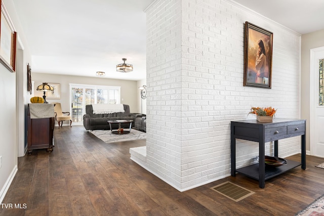 hallway featuring dark wood-type flooring and visible vents