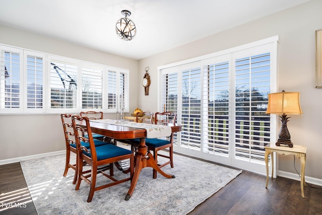 dining area with wood finished floors and baseboards