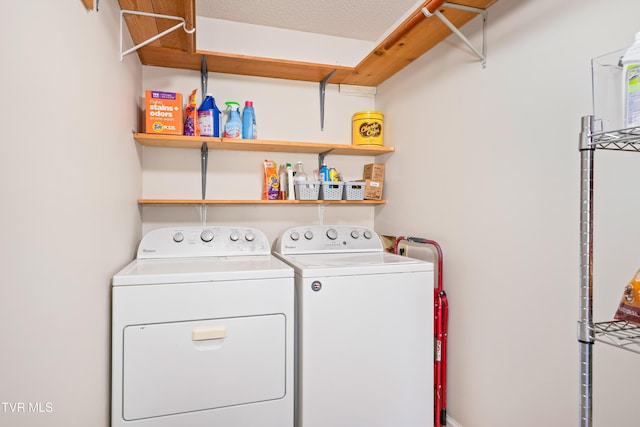 laundry area with laundry area and washer and clothes dryer