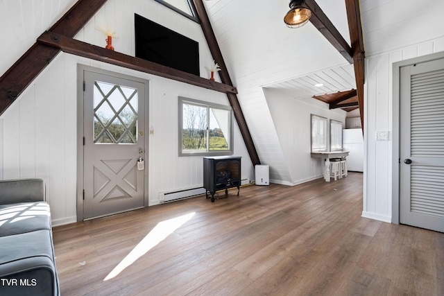 foyer with baseboards, vaulted ceiling with beams, wood finished floors, and baseboard heating