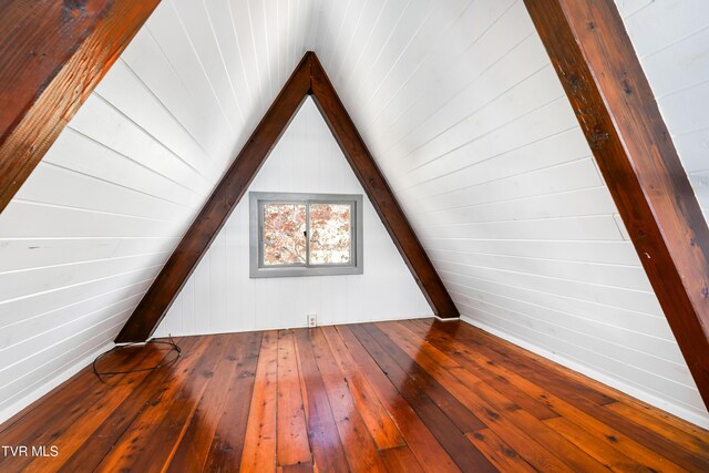 bonus room featuring vaulted ceiling and hardwood / wood-style floors