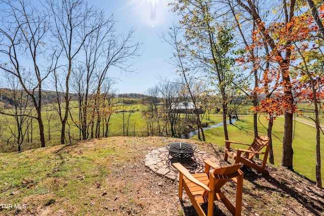view of yard featuring a fire pit