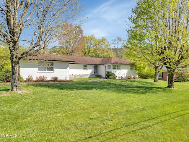 ranch-style house with a front lawn
