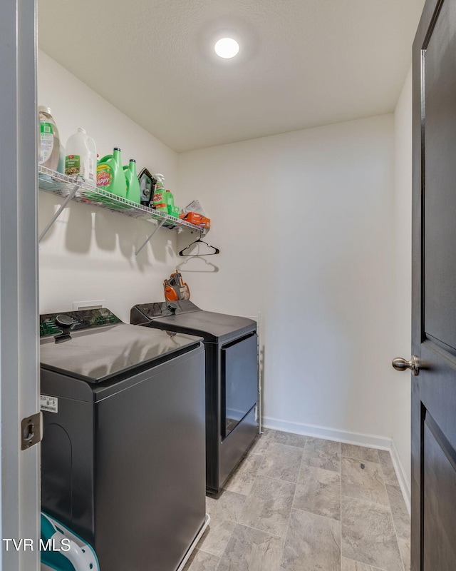 1205 Stamp Lodge Rd, Kingsport, TN 37660 - laundry room featuring baseboards, washer and dryer, and laundry area
