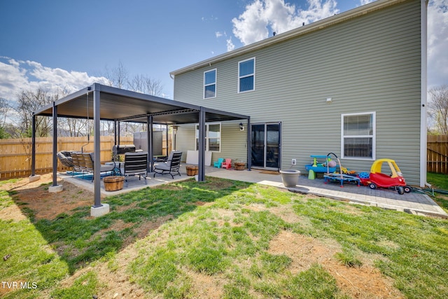 1205 Stamp Lodge Rd, Kingsport, TN 37660 - rear view of house featuring fence, a patio area, and a lawn