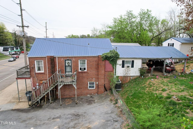 1416 Lynn Garden Dr, Kingsport, TN 37665 - view of front of home with brick siding, metal roof, and central AC