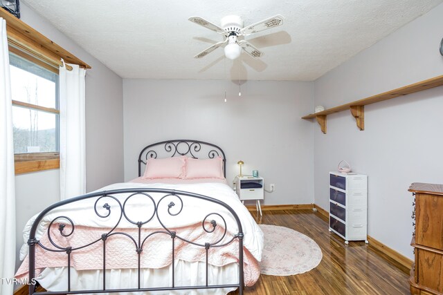 23324 Denton Valley Rd, Abingdon, VA 24211 - bedroom with baseboards, a textured ceiling, wood finished floors, and a ceiling fan