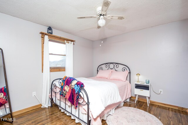 23324 Denton Valley Rd, Abingdon, VA 24211 - bedroom featuring baseboards, a ceiling fan, wood finished floors, and a textured ceiling