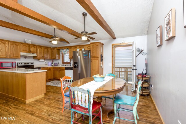 23324 Denton Valley Rd, Abingdon, VA 24211 - kitchen featuring light countertops, a ceiling fan, wood finished floors, under cabinet range hood, and stainless steel appliances
