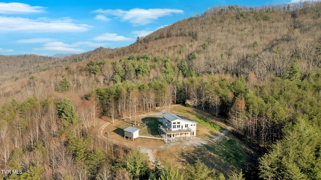 bird's eye view with a mountain view and a view of trees