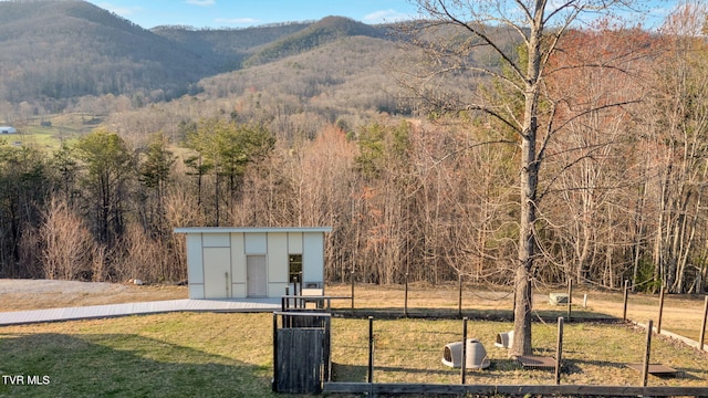 view of mountain feature with a forest view
