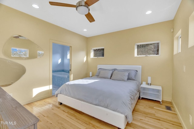 bedroom with baseboards, light wood-style floors, and recessed lighting