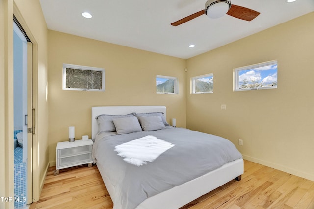 bedroom featuring recessed lighting, baseboards, and light wood-type flooring